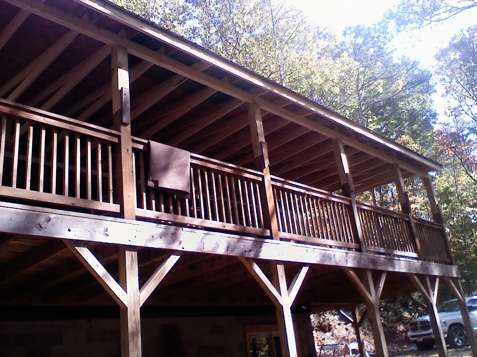 Timber framing under a new elevated porch and deck — Roof Leak Repair in West Warwick by Roofing Brothers
